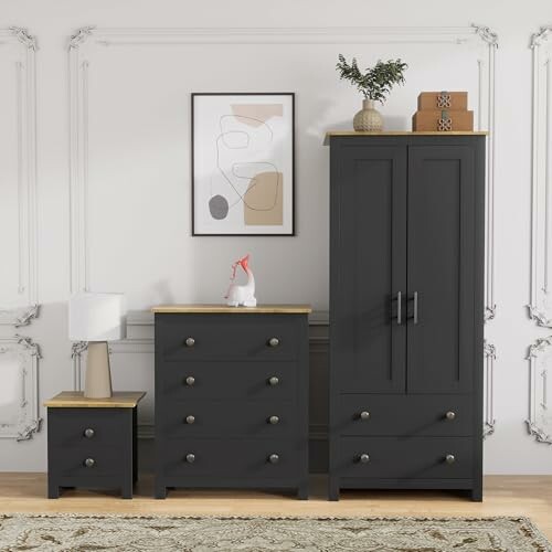 Set of modern black bedroom furniture with a nightstand, dresser, and wardrobe.